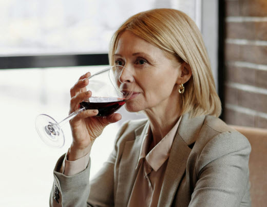 woman tasting wine